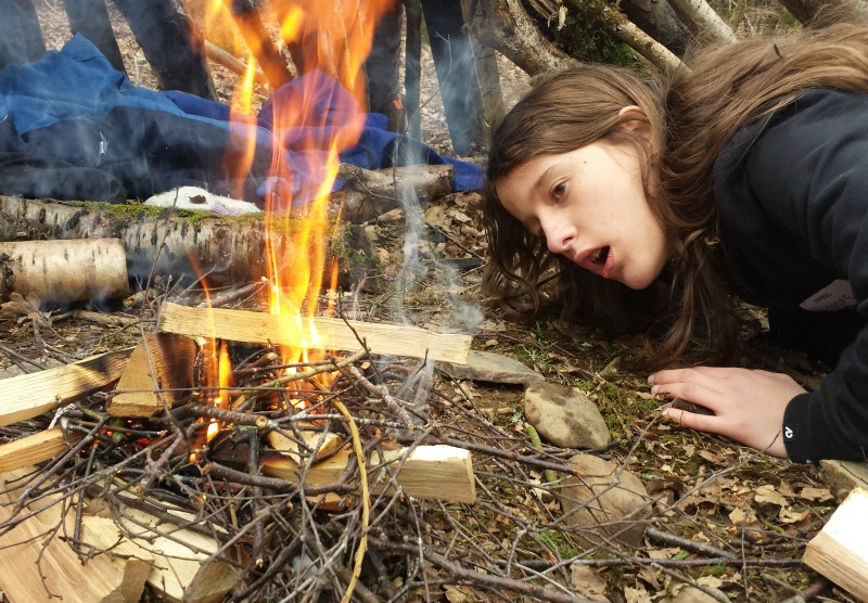 children learning firelighting skills